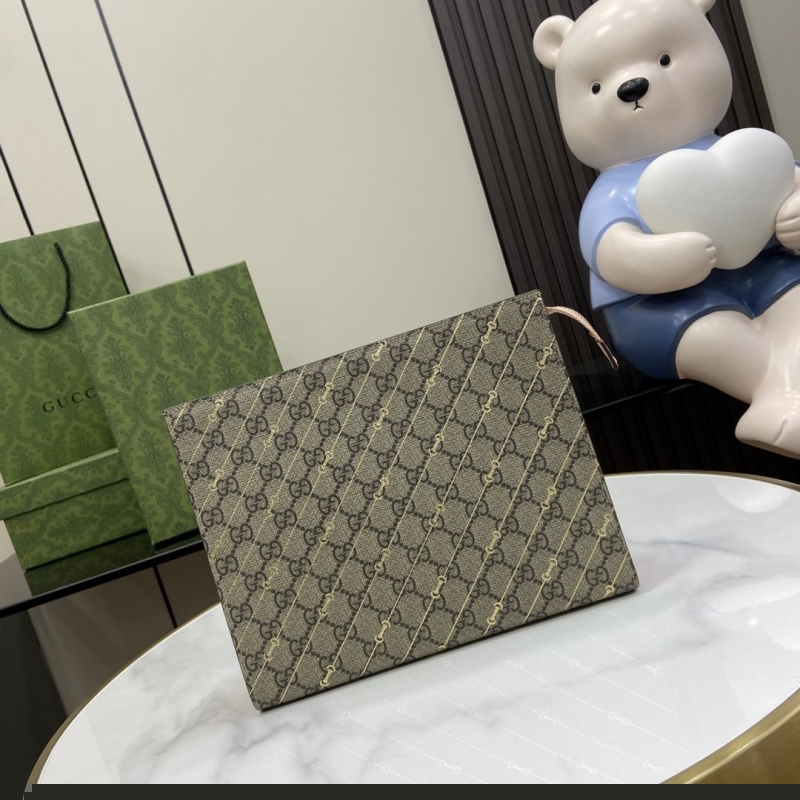 G*u*i clutch bags